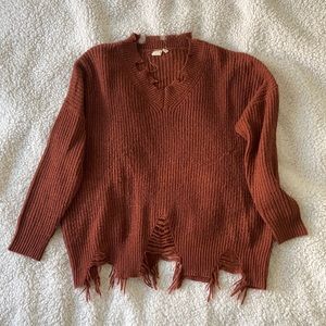 Boutique sweater ripped